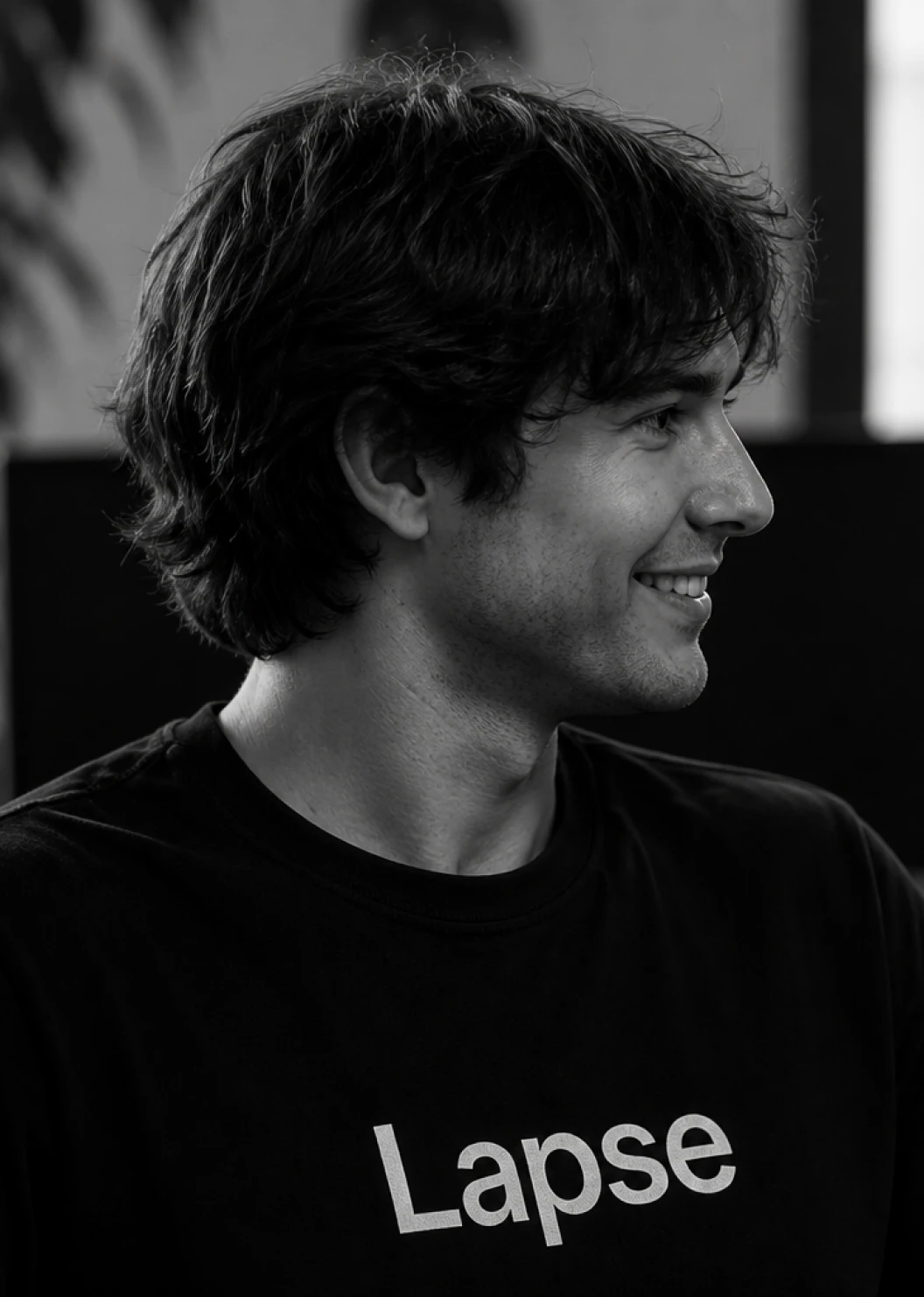 Marcus Oyelaran in profile, smiling